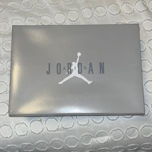 The grey and white Air Jordan 11 Retro (GS) size 4y